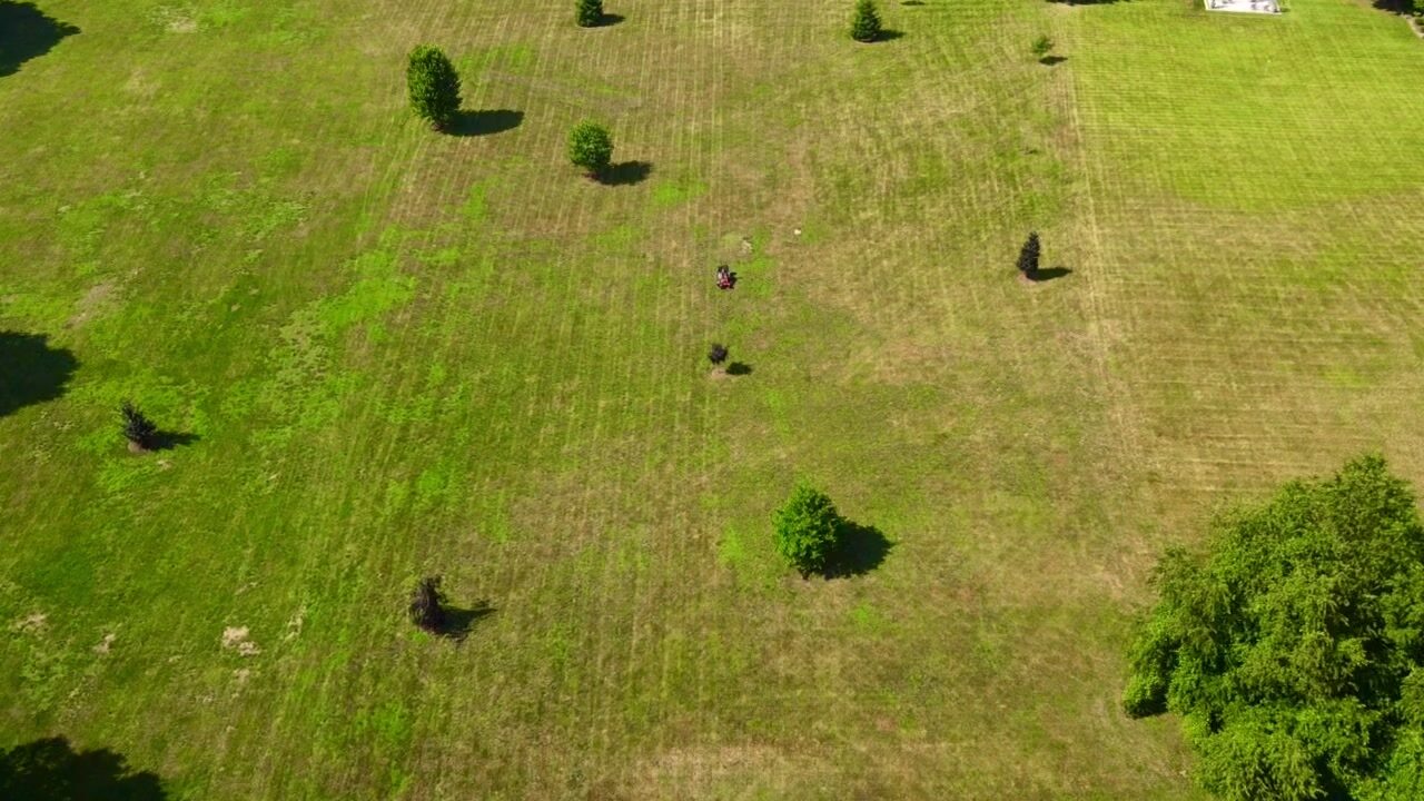 Aerial view of expansive striped lawn on a private estate